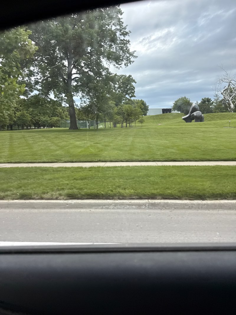 walking near me in The Donald J. Hall Sculpture Park in spring