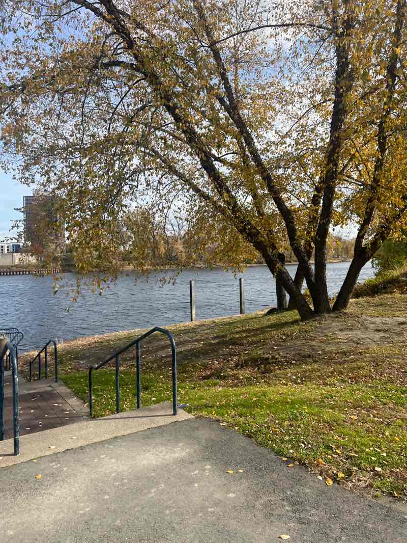 walking near me in Mortensen Riverfront Plaza in autumn