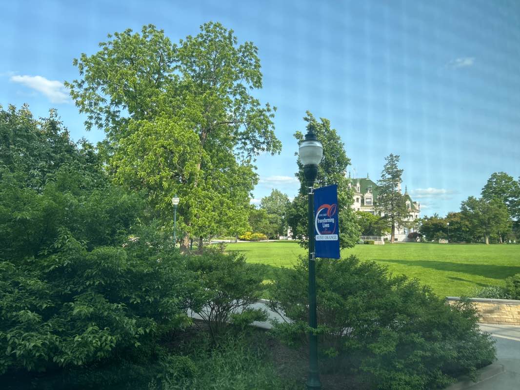walking near me in Alumni Green in summer