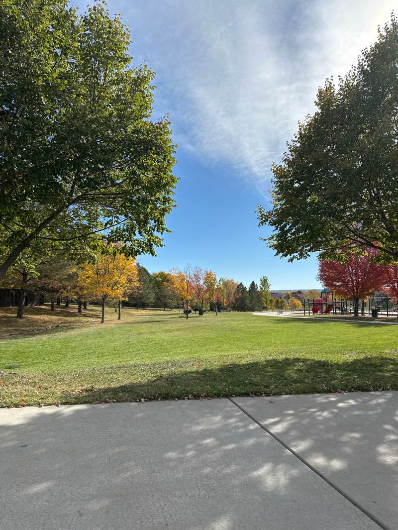walking near me in Stonegate Village Park in autumn