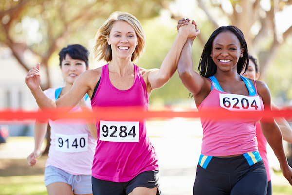 Women celebrating finishing a race together