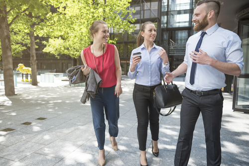 Office workers walking and talking during lunch break