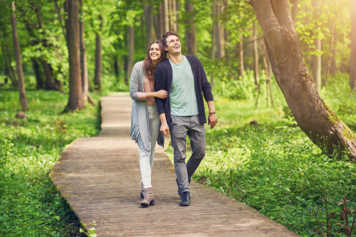Couple walking in nature and having fun