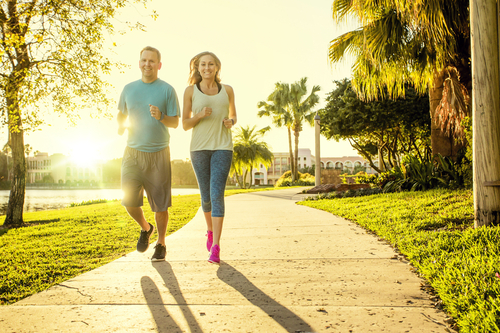 Couple walking in a morning sunrise