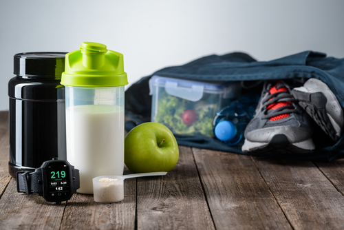 Workout gear, lunch and protein shake packed up