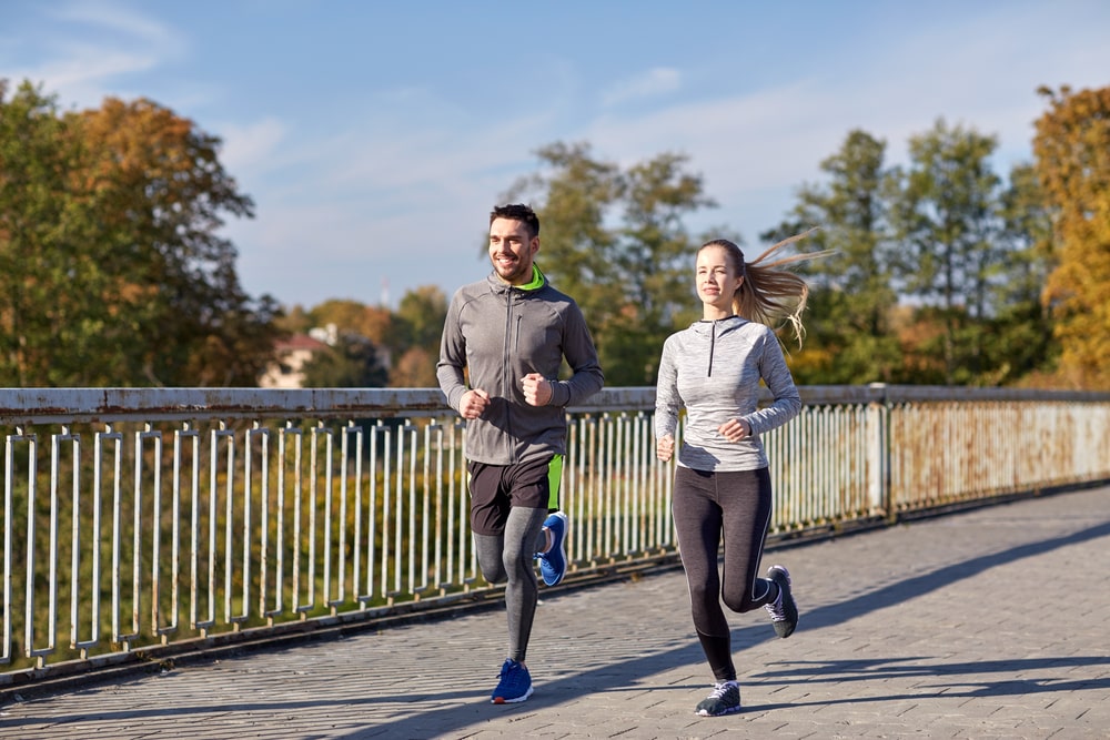 Man and woman running together for fitness