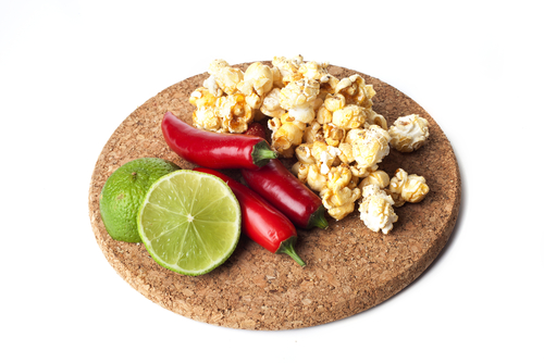Jalapeno popcorn with limes and chili peppers