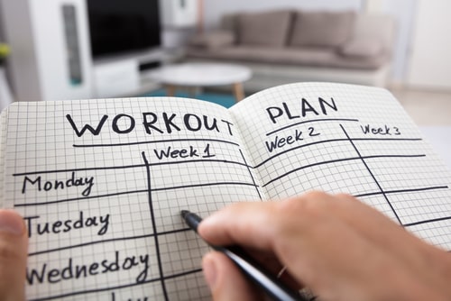 Workout plan in notebook planning concept