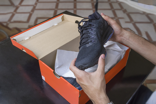 Unboxing new black walking or running shoes