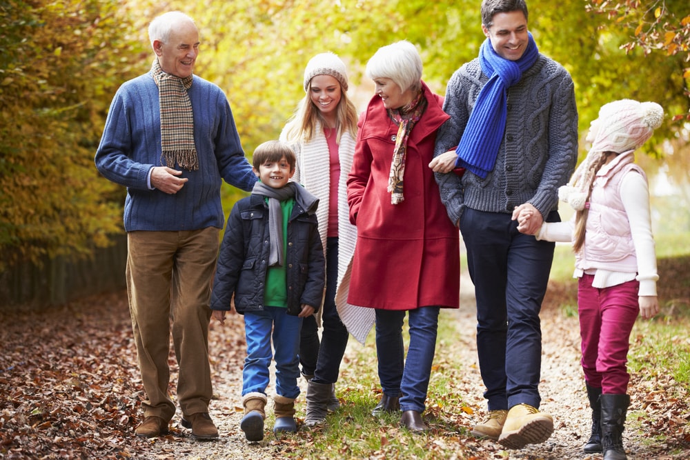 Multi-generational family walking in autumn