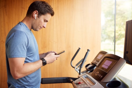 Man walking on treadmill at home