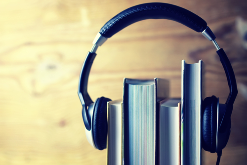 Headphones on books - listen to audiobooks concept