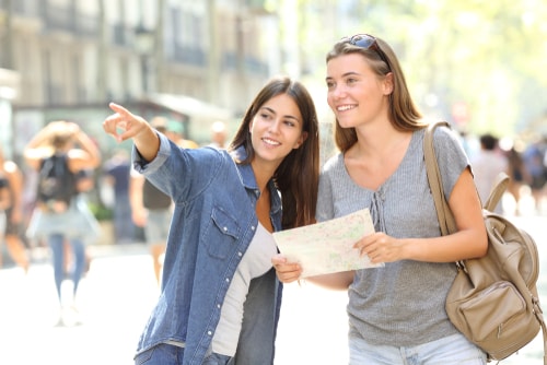 woman giving tourist directions on the street