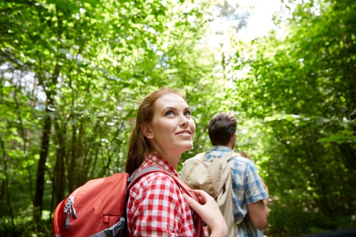 Woman feeling happy walking in nature