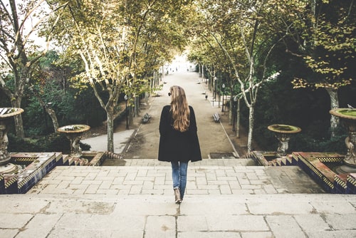 Woman walking down beautiful outdoor staircase