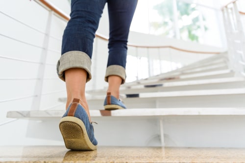 woman walking up stairs for exercise
