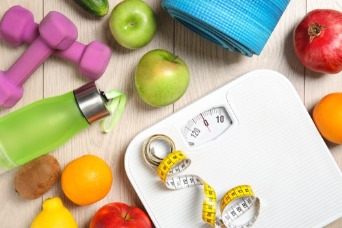 Scale with healthy foods - weight loss concept
