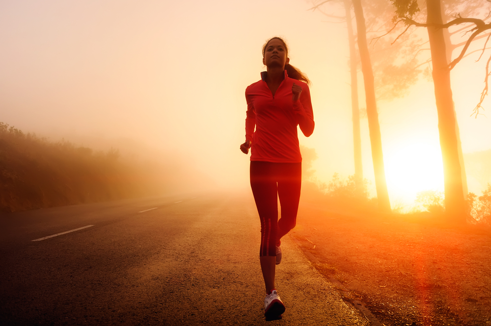 Woman walking on road in the morning