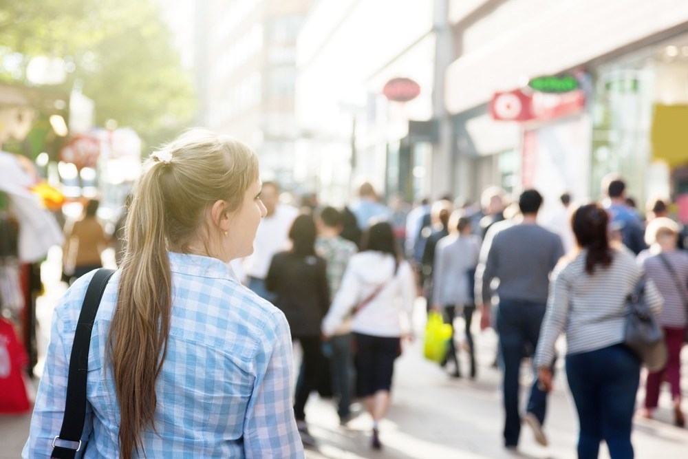 Woman walking in a crowded city street