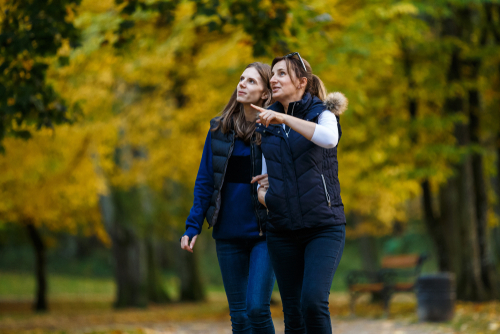 2 Women Walking in Natural Park