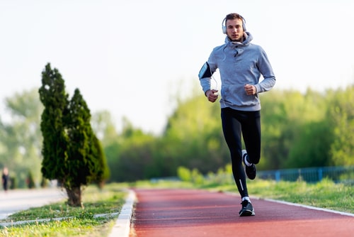 Man running on jogging path