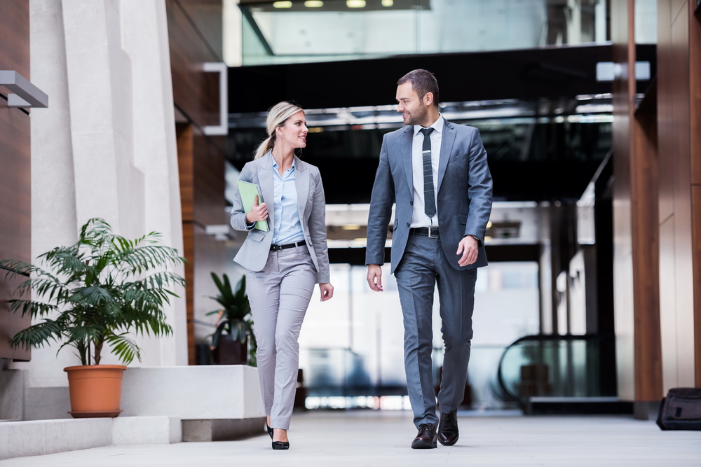 Businesspeople walking together in an office building
