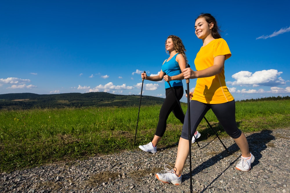 Women nordic walking in an natural setting