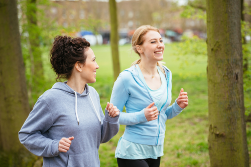 Happey women walking together in park