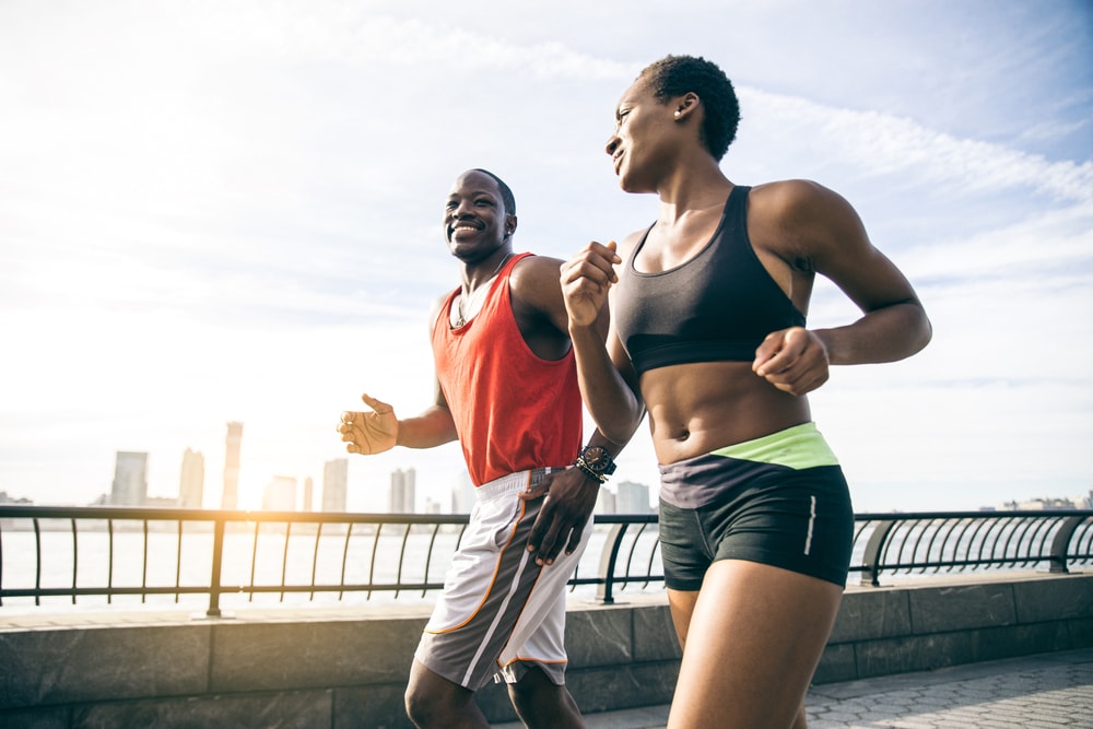 Couple going for a morning jog near water