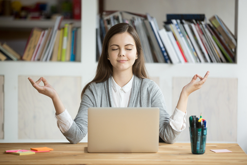 Woman meditating at work