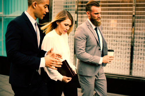 Employees walking and having a meeting