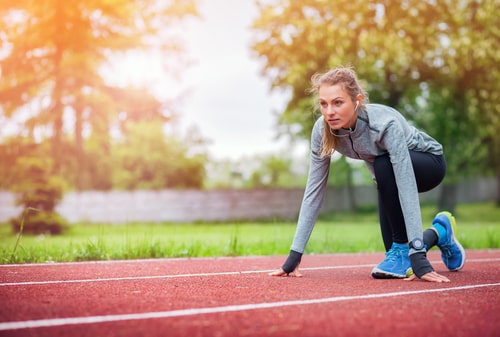 Woman getting ready to run