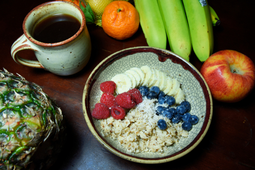 Healthy oatmeal with fruit and coffee