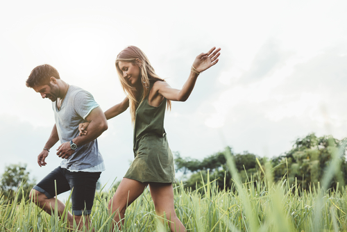 Happy couple enjoying a walk in the countryside