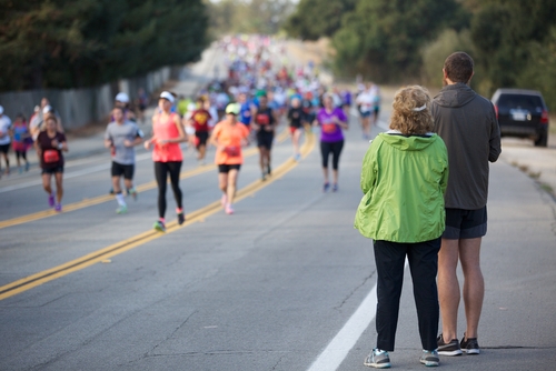 People watching a distance running race