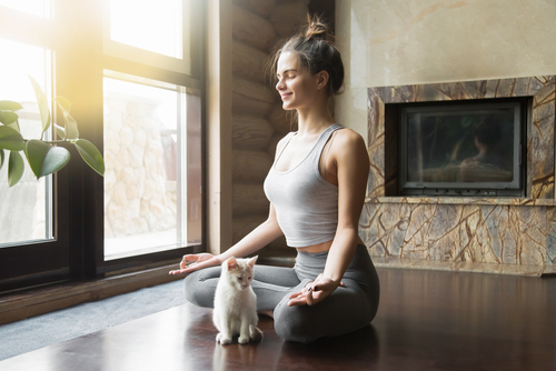 Woman doing yoga at home - rest day concept
