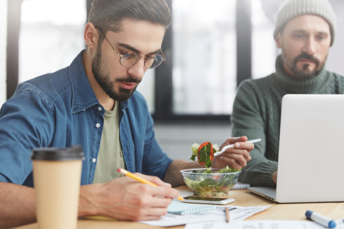 Workers eating healthy together