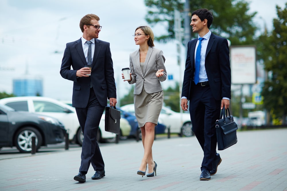 Active businesspeople walking to work