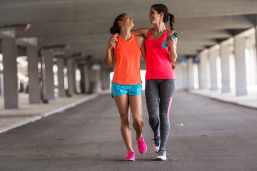 Women walking together after a workout