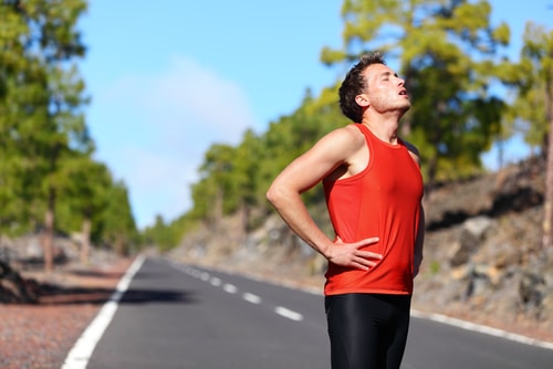 Male jogger or walker taking a break
