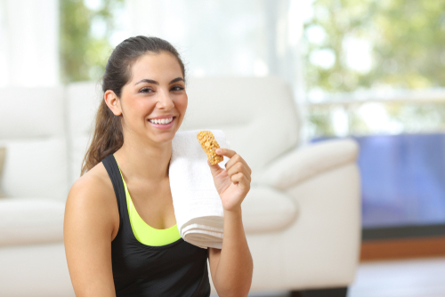 Woman eating a snack after a workout