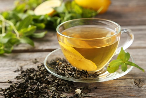 Healthy unsweetened green tea and tea leaves