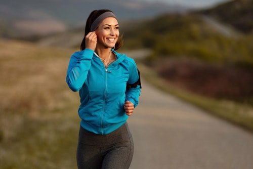 Woman going for a fitness walk in the countryside