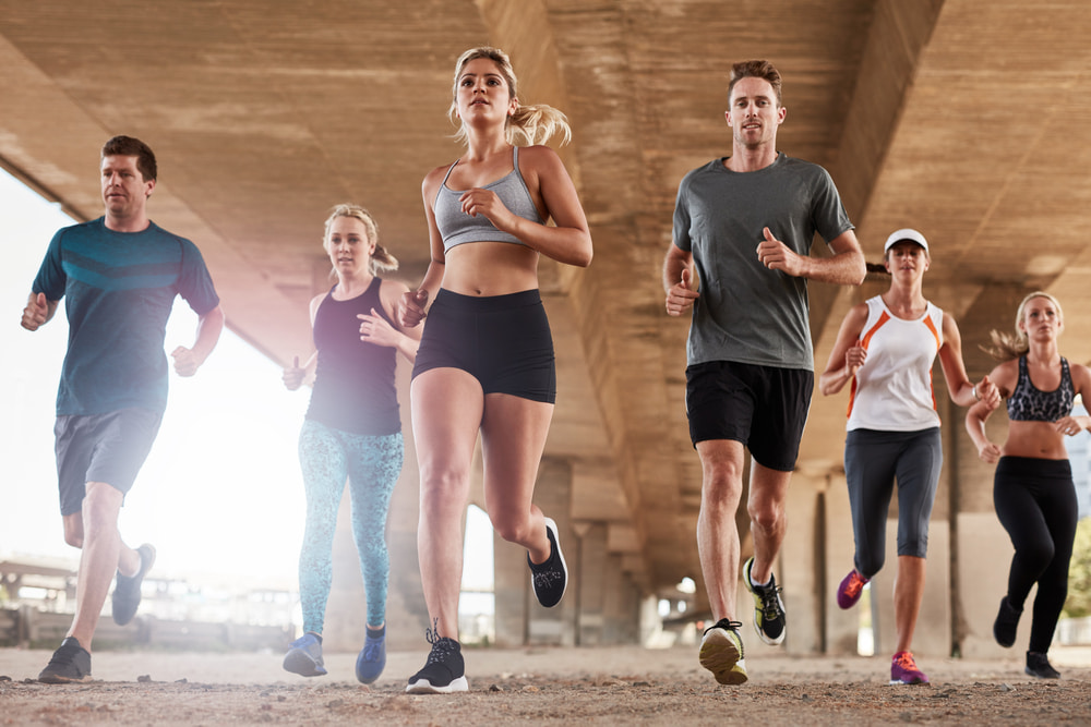 Group of people running together for fitness