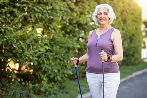 Senior getting ready to walk with poles