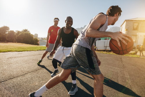 Men playing basketball