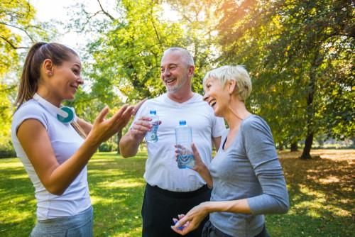 Friends drinking water during an exercise session