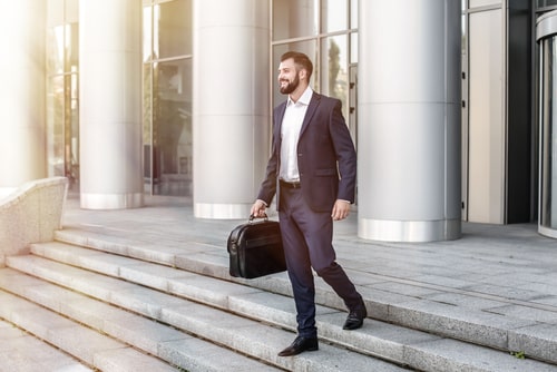 Businessman walking outside of his office