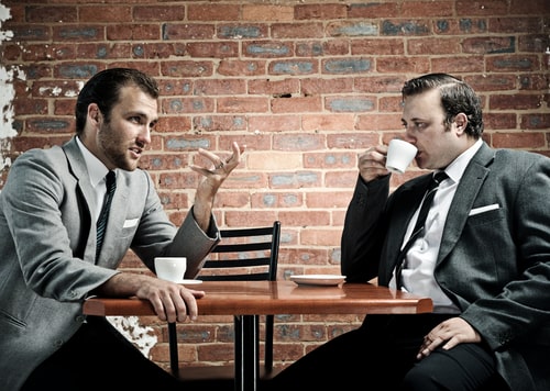 Men drinking coffee in a cafe