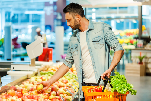 Man choosing healthy fruits and vegetables